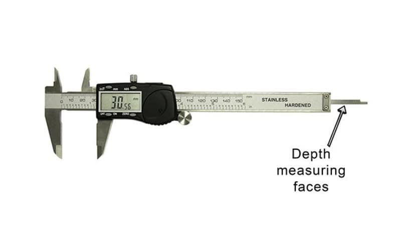 Depth caliper measuring hole depth in metal component