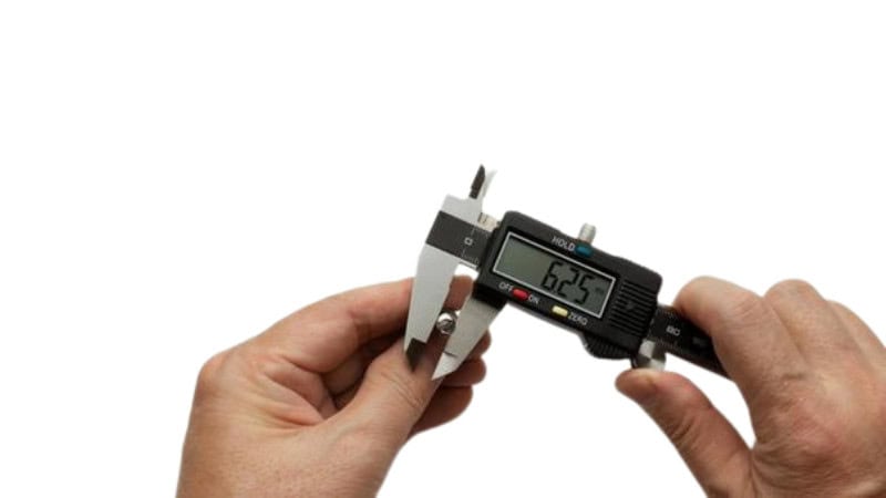 Digital caliper measuring bolt diameter for automotive repair work